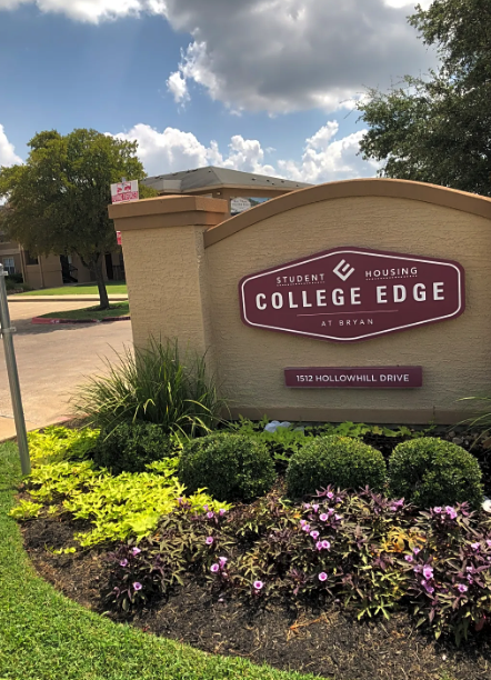 A sign for College Edge apartments