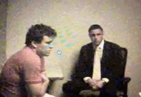 Blurry footage of Jeremy Rosser undergoing police questioning
